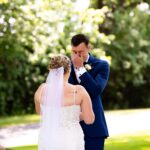 Groom crying at a first look at his soon to be bride.
