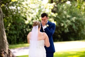 Groom crying at a first look at his soon to be bride.