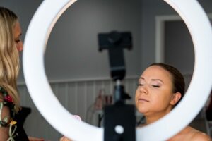 Bride with professionally applied makeup in soft natural lighting, showcasing smooth complexion and even skin tones.