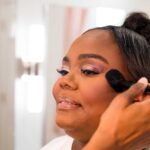 Close-up, darker skin, bridal portrait featuring airbrushed makeup that reduces texture and softens fine lines.