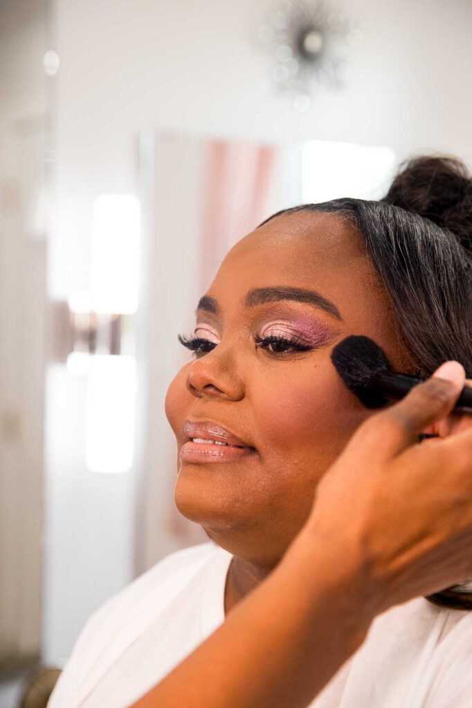 Close-up, darker skin, bridal portrait featuring airbrushed makeup that reduces texture and softens fine lines.